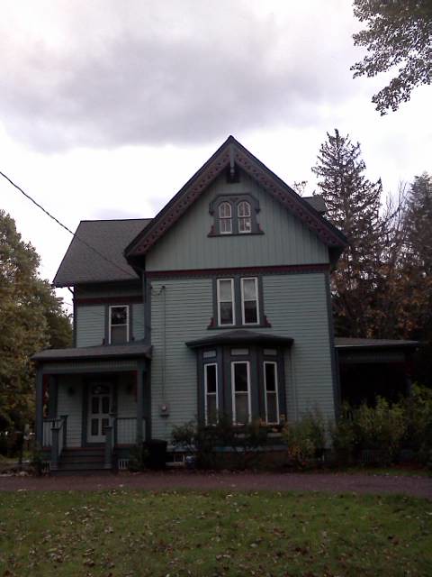 Professional siding and paint work on house exterior